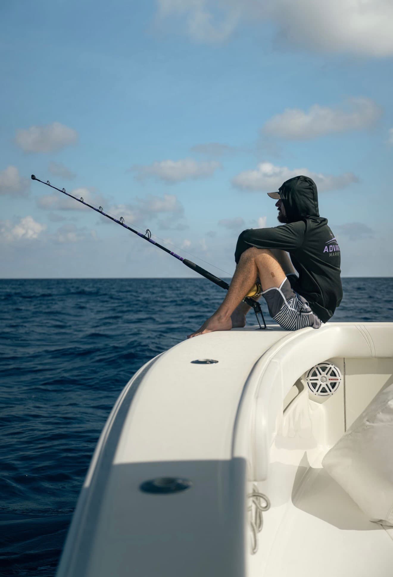 Ryan Dunnam fishing off the bow of a center console offshore